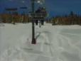 Snowboarder Jumps Off Ski Lift