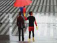 Superhero Rescues People From Rain