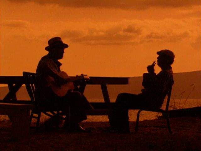 Manu Kahaialii and ʻohana at the beach 2/28/91 and Eddie Kamae and David Kaʻalakea at sunset 2/29/92